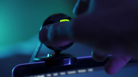 Close up on webcam hand adjusts its angle. Sitting on computer screen or laptop Stock Footage 158552016