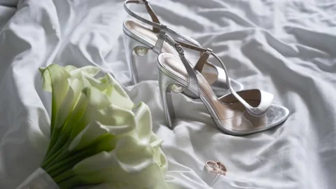 Close-up wedding accessories of the bride, wedding bouquet, bride's shoes Stock Footage 168765622