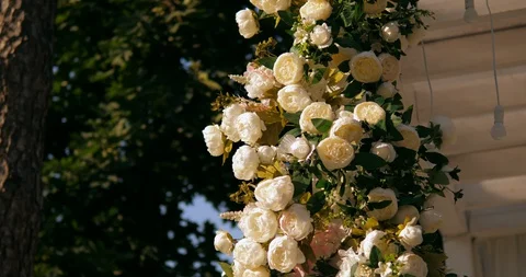 Close up of the wedding ceremony arch decorated with fresh flowers.  Stock Footage 130049130