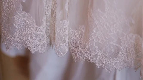 Close up of wedding cloth with lace. Wedding preparation. Wedding dress on Stock Footage 73781713