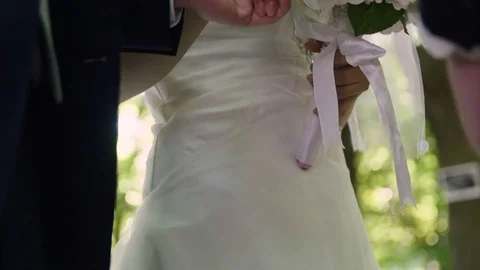 Close up of wedding couple holding hands at the alter 4K Stock Footage 76431394