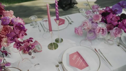 Close-up of wedding table decorated with pink flowers and candles Stock Footage 232485436