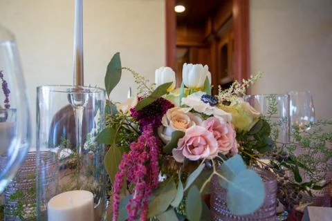 Close up of wedding table set decorated with fresh flowers. Stock Photos