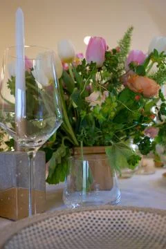 Close up of wedding table set decorated with fresh flowers. Stock Photos