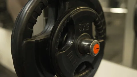 Close up on weight plate on a Smith machine in a modern gym Stock Footage 303586458