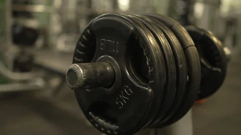 Close up on weight plate on a Smith machine in a modern gym Stock-Footage 303586507
