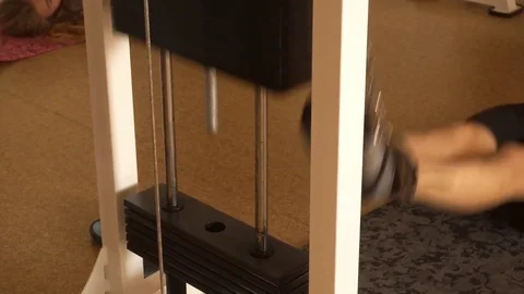 Close up of weight stack from a cable exercise machine Stock Footage 82226996