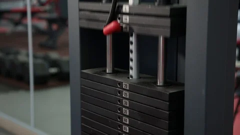 Close up of weight stack from a cable exercise machine 4k. Gym and workout Stock Footage 102514485