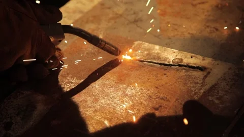 Close-up. A welder cuts a pattern for metal. Stock Footage 136311241