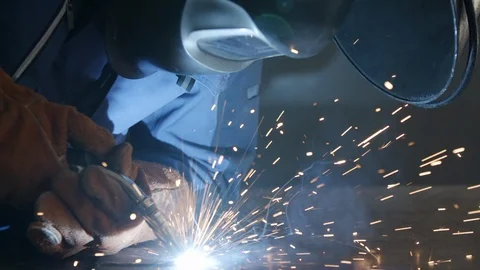 Close-up welder works with metal using a welding machine in slow motion Stock Footage 115159003