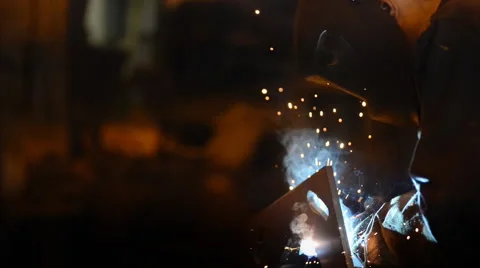 Close up Welding Engineer weld attaching the base of pipes.a lot of bright Stock Footage 57513546