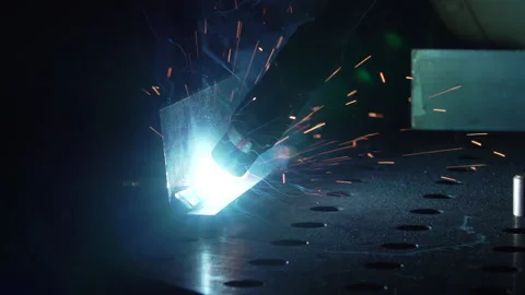 Close up on welding gun tip creating metal joint with bright light and sparks 스톡 동영상 194608909