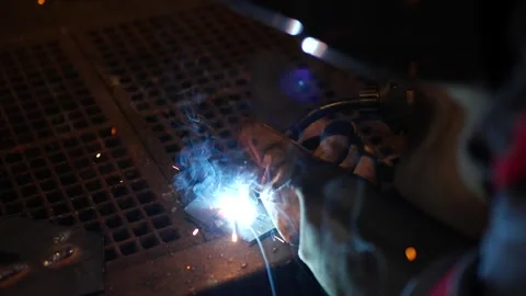 Close-Up of Welding Process with Sparks and Bright Arc Light Stock Footage 306682195