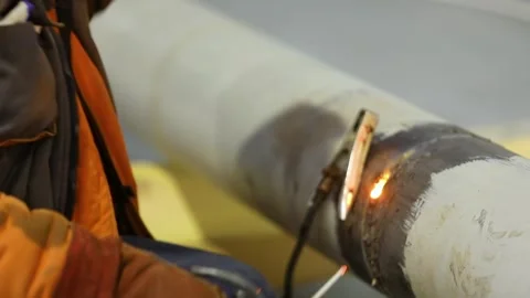 Close-up of welding work. Construction site. Welding work. Welder welding a pipe Видео 320021675