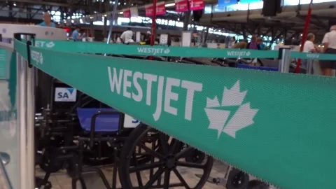 Close up of WestJet queue barrier ribbon at an airport check in area. Stock Footage 341593215