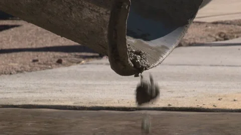 Close up of wet concrete mix dropping from cement mixer chute Video stock 39909739
