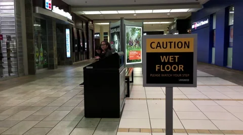 Close up wet floor caution sign inside shopping mall 動画素材 55923489