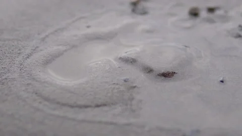 Close-up of wet sand falls on the river bank creating different shapes Stock Footage 142893054