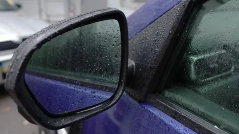 Close-up of a wet side rear view mirror of a car on a rainy autumn day.  Stock Footage 287918110