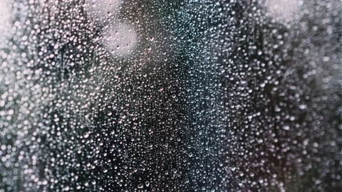 Close-up of wet window glass with rain drops. Stock Footage 201316713