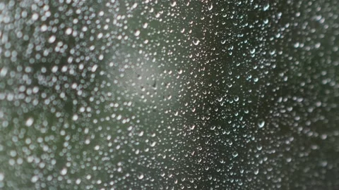Close-up of wet window glass with rain drops. Stockbeeldmateriaal 205537371
