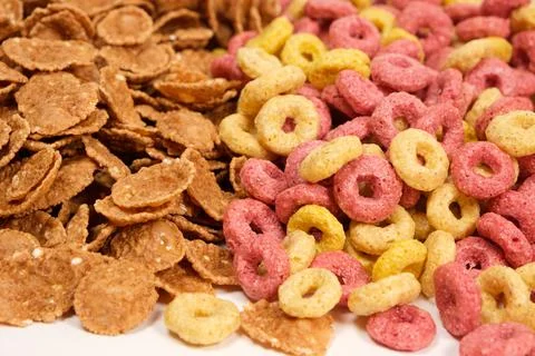 Close-up of wheat flakes and corn rings, top view. Stock Photos