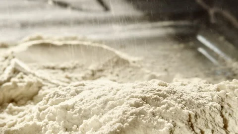 Close up of wheat flour scattered onto pile in the process of baking bread Video stock 151730968