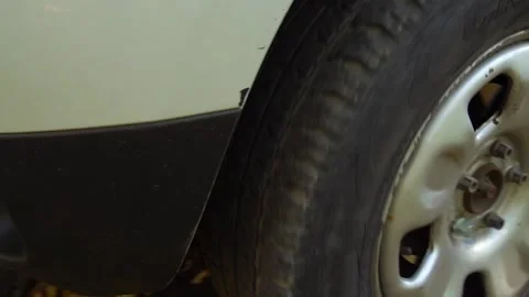 Close-up of the wheel of a moving car Video HD slow motion Stock Footage 169906338