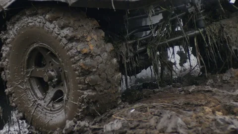 Close up of wheel in the Mud. Off-road car wheel slips in the mud, but moves Vidéo 77429404