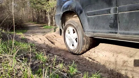 Close up of wheel spinning. Motion the wheel tire off road. Stock Footage 134628973
