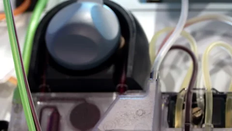 Close Up of Wheel Turning on Apheresis Machine Stock Footage 316229947