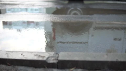Close-up of the wheels of the car to drive through a puddle Stock Footage 159769159