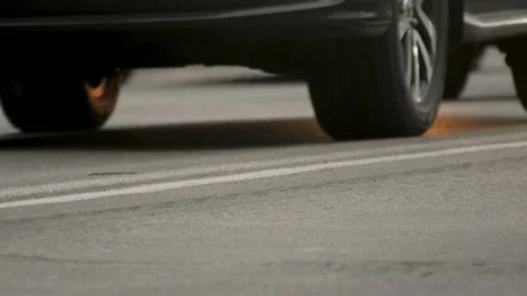 Close up wheels in motion car freeway traffic road asphalt background vehicles Stock Footage 164881937