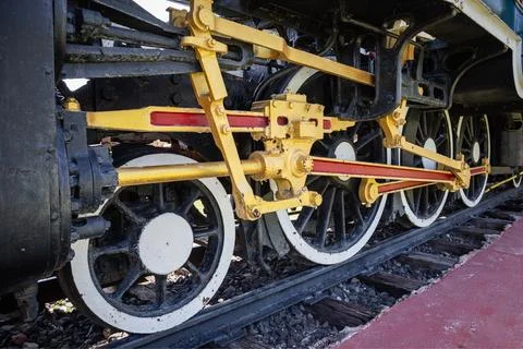 Close-up of the wheels of a steam engine with an interlocking mechanism. Stock Photos