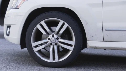 Close up of wheels of traffic vehicles driving past camera Stock-Footage 85170343