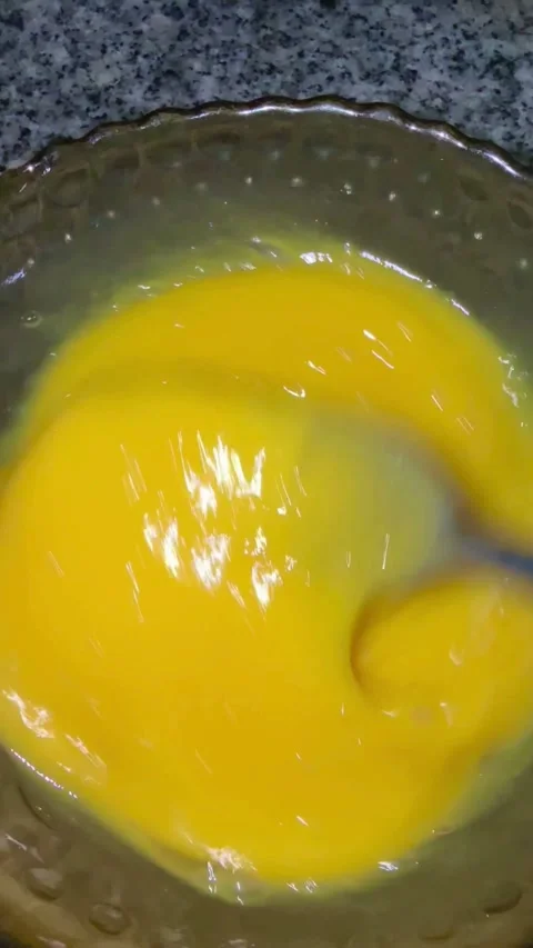 Close up of whisking raw egg yolks with fork Stock Footage 331974745