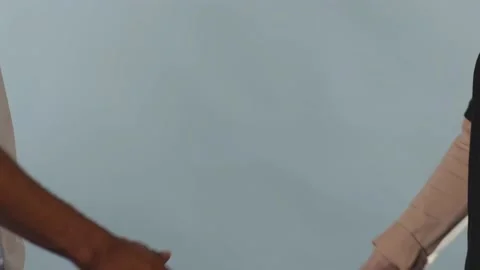 Close up white and black men shake hands stop racism all people are equal Stock Footage 133640745