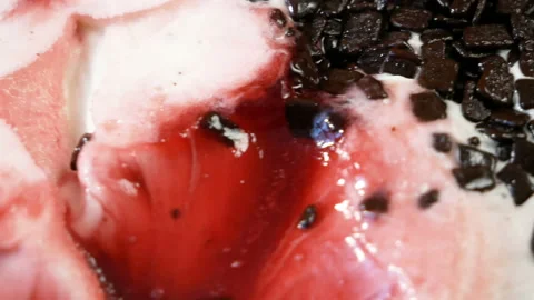 Close up of white and red ice cream, ice cream with strawberries jam and choc Stock Footage 154628046