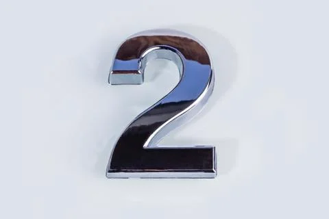 Close-up. on white background. no isolation. number two, with a metallic shee Stock Photos