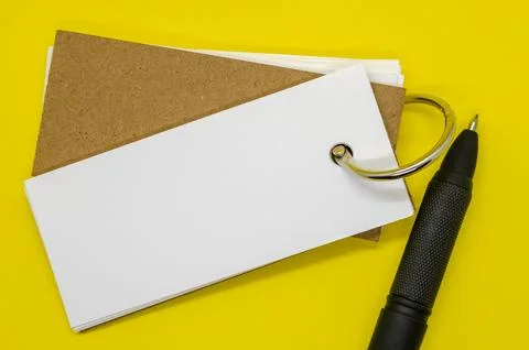 Close up of white banner shape notepad with customizable space for text on .. Stock Photos