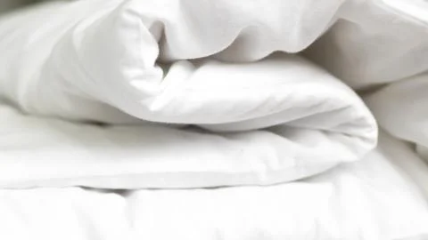 Close up of white bedsheet background ,good hotel service Stock Photos