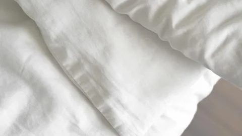 Close up of white bedsheet background ,good hotel service Stock Photos
