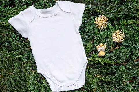 Close up white blank template bodysuit with copyspace and Christmas decor Stock Photos