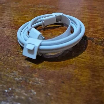 A close-up of a white braided USB Type-C cable. Stock Photos