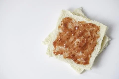 Close-up of white bread with raspberry jam Stock Photos