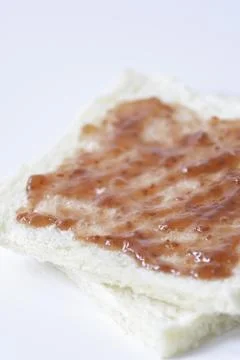 Close-up of white bread with raspberry jam Stock Photos