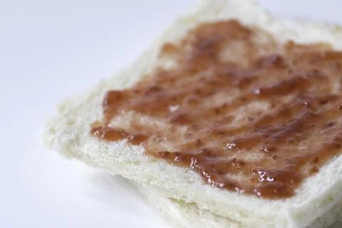 Close-up of white bread with raspberry jam Stock Photos