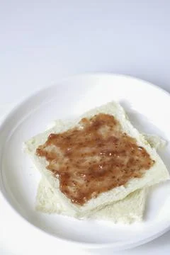 Close-up of white bread with raspberry jam Stock Photos