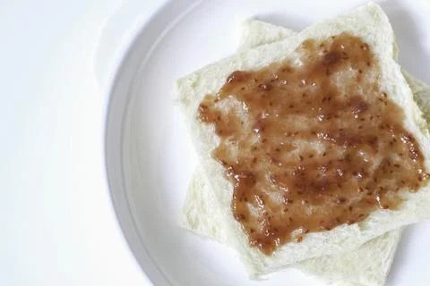Close-up of white bread with raspberry jam Stock Photos