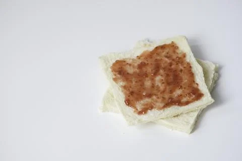 Close-up of white bread with raspberry jam Stock Photos